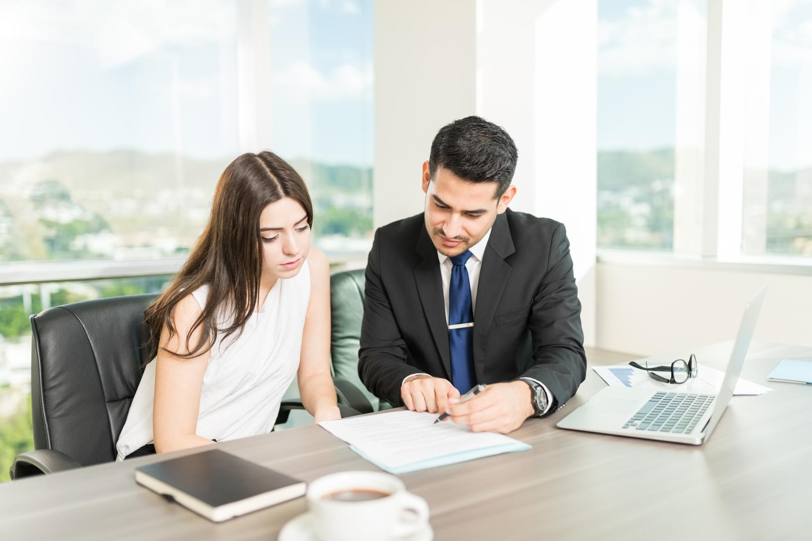 young-adviser-explaining-legal-document-client-his-office